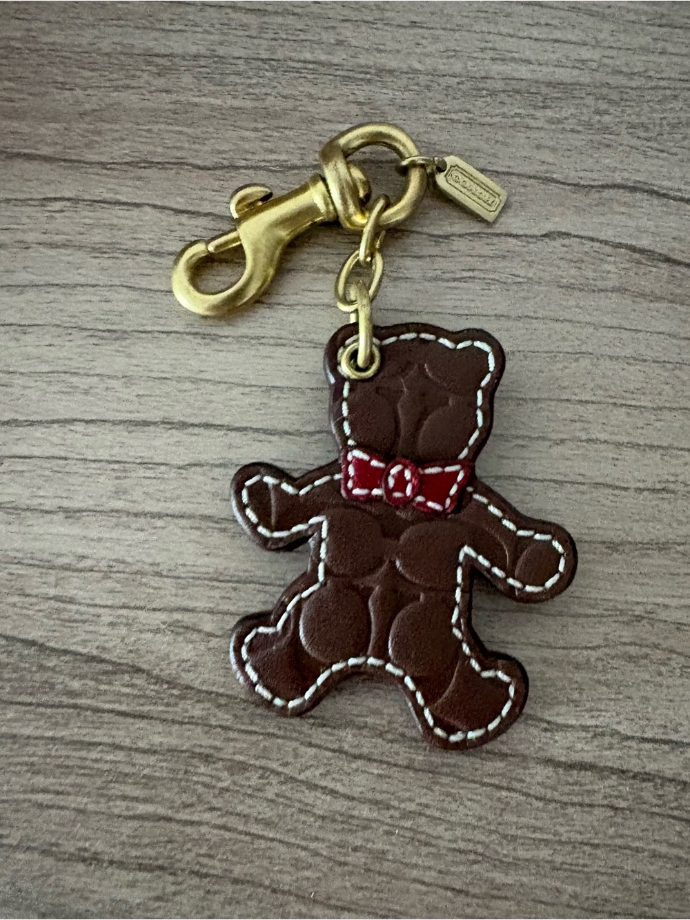 Coach signature Brown Bear Leather Key Charm with Red Bow and Gold Hardware